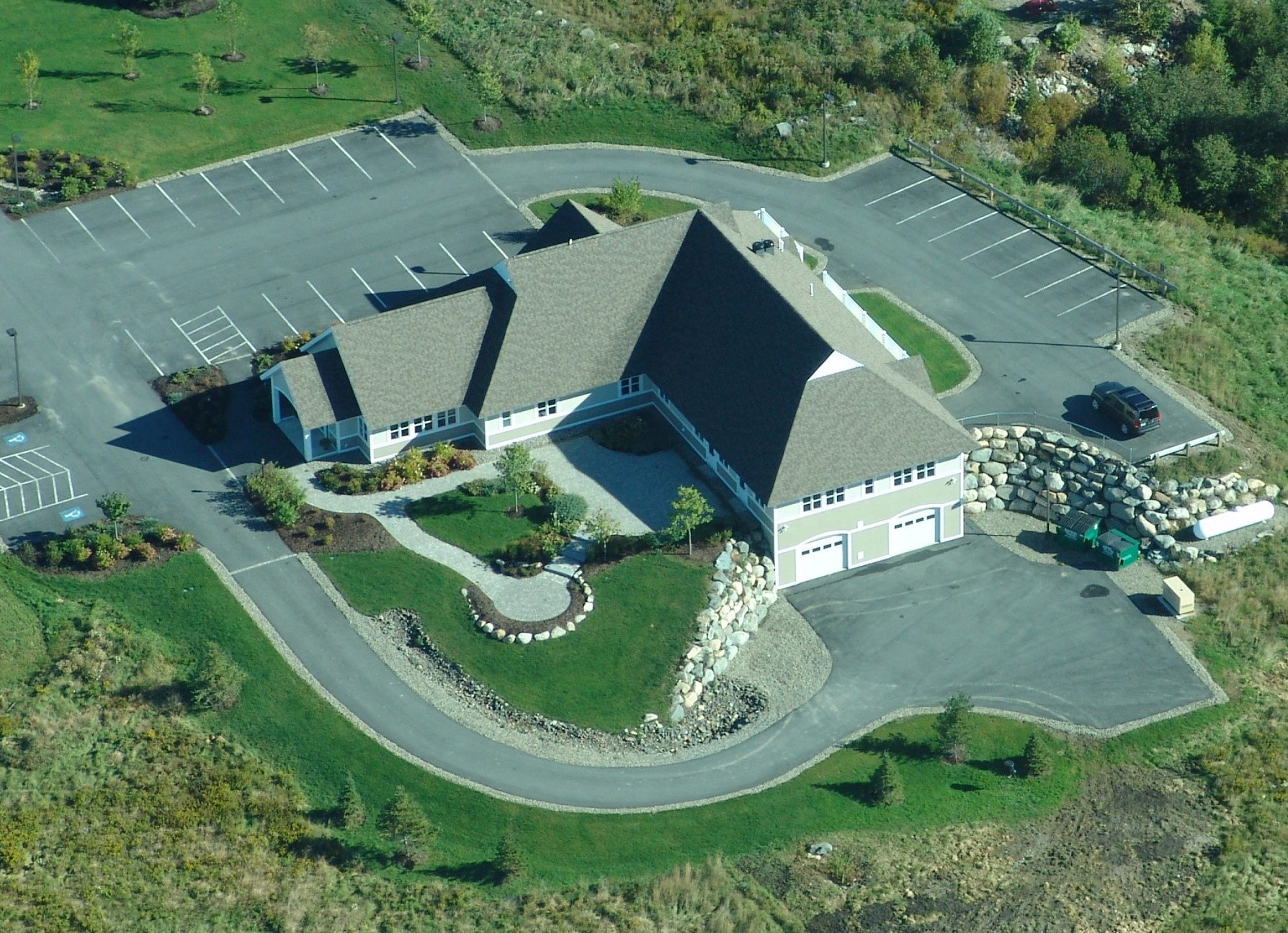 Aerial view of Machias Dental office with parking lot and greenery